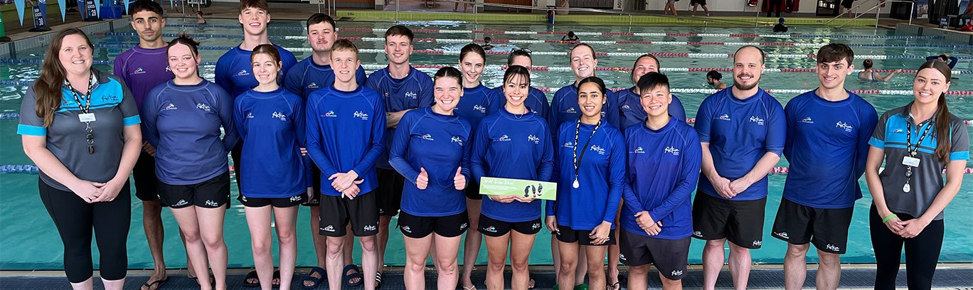 AFAC Swim Instructors in a group photo in front of the pool