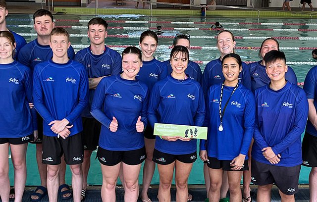 AFAC Swim Instructors in a group photo in front of the pool
